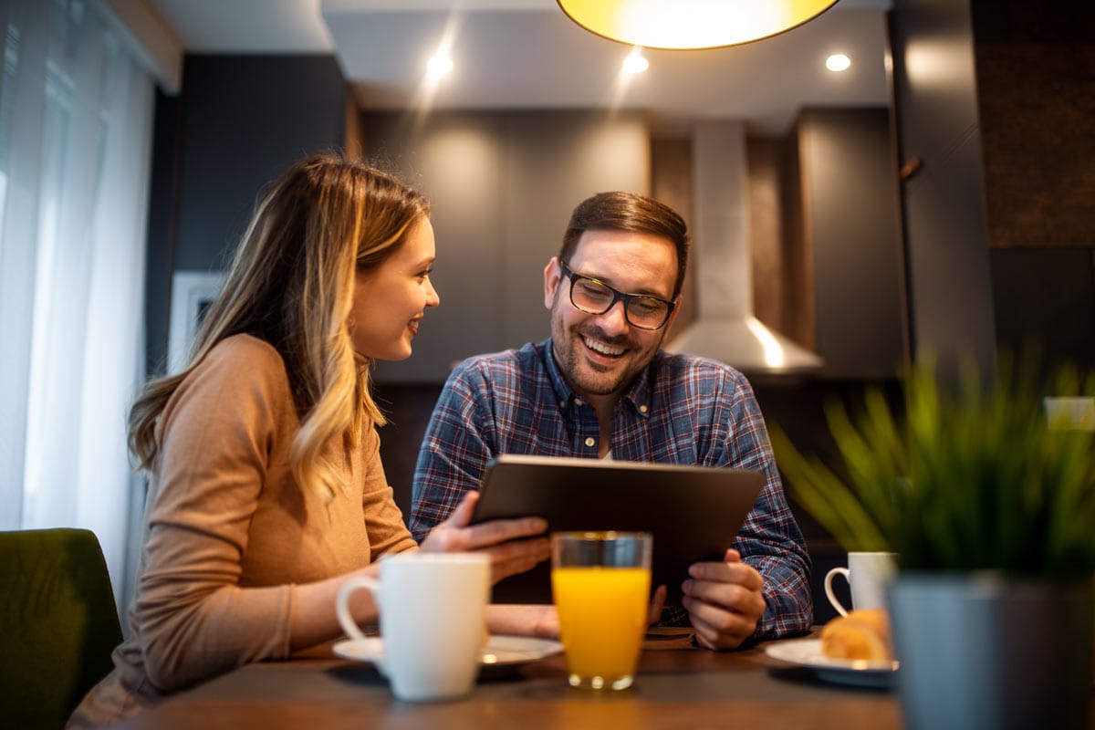 couple in kitchen discussing plans