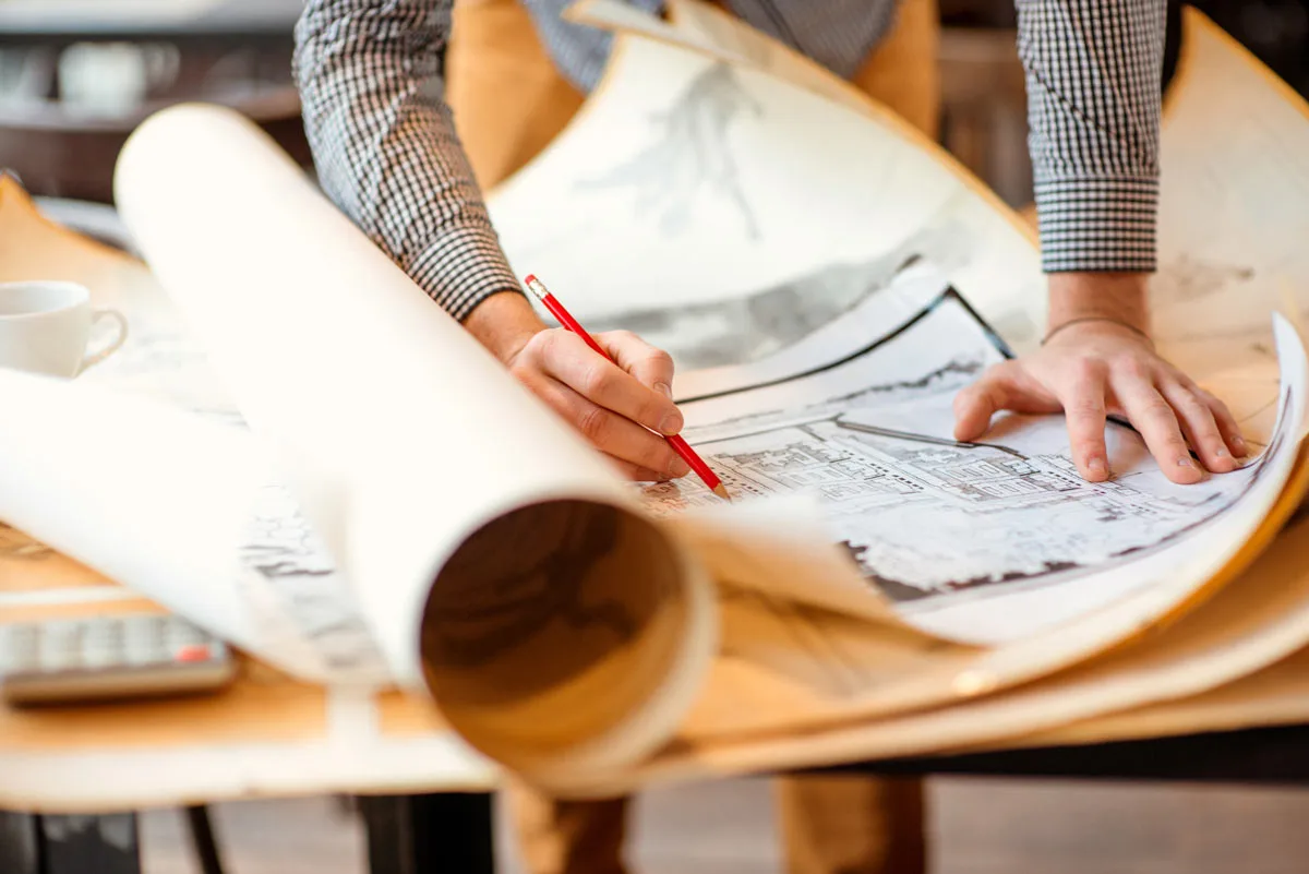 Architect correcting plans