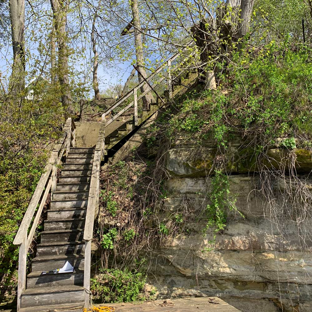 Stairs of lakeside home before remodel