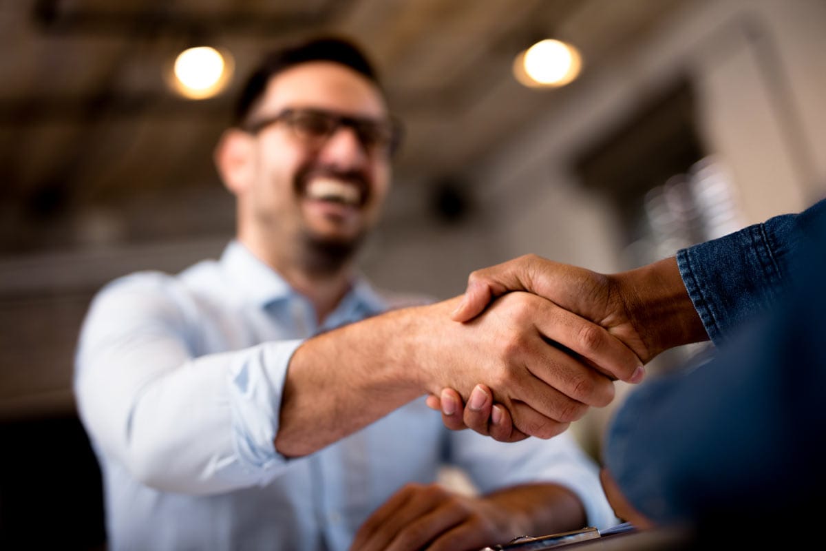 Client and project manager shaking hands