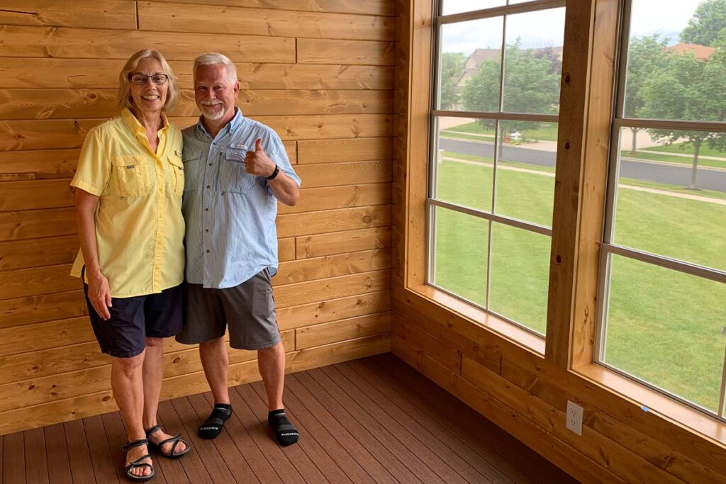 Happy homeowners in new 3 season porch