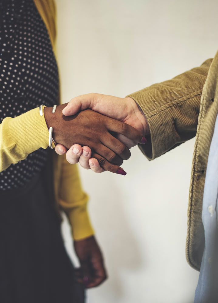 Woman and man shaking hands